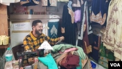 A young Tibetan works in his embroidery shop on May 26, 2023, in the Tibetan colony in Srinagar, Jammu and Kashmir, India.