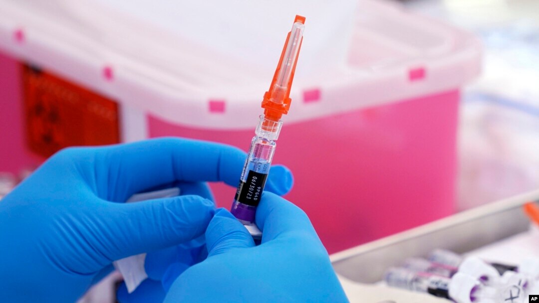 FILE - A flu vaccine is readied at the LA Care and Blue Shield of California Promise Health Plans' Community Resource Center in Lynwood, Calif., on Oct. 28, 2022. 