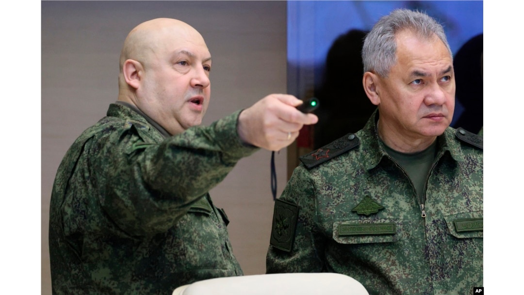 FILE - The top Russian military commander in Ukraine, Gen. Sergei Surovikin, left, and Russian Defense Minister Sergei Shoigu, right, at an unknown location, Saturday, Dec. 17, 2022.