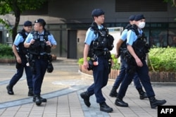 Police patrol at Victoria Park in Hong Kong, June 2, 2023, where residentstraditionally gathered annually to mourn the victims of China's Tiananmen Square crackdown in 1989. Authorities have banned protests on the anniversary.
