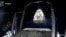 In this frame grab from video broadcast by SpaceX, recovery crews lift and secure the SpaceX Dragon capsule after it splashed down into the Gulf of Mexico, just off the Florida Panhandle, on May 30, 2023. (SpaceX via AP)