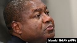 FILE — Mozambique's President Filipe Nyusi listens during a meeting with U.S. officials in Washington D.C., on September 22, 2023. 