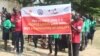 HIV activists hold up a banner during a gathering at Nyakuron Cultural Center in Juba, South Sudan to mark World AIDS Day, Dec. 1, 2023.