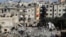 Palestinians look at the destruction after an Israeli strike on a residential building in Rafah, Gaza Strip, March 3, 2024. 