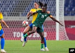 FILE - Brazil's Angelina, back, and Zambia's Barbra Banda battle for the ball during a women's soccer match at the 2020 Summer Olympics, July 27, 2021, in Saitama, Japan.