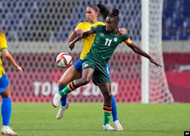 FILE - Brazil's Angelina, back, and Zambia's Barbra Banda battle for the ball during a women's soccer match at the 2020 Summer Olympics, July 27, 2021, in Saitama, Japan.