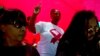 FILE - A woman dances as she listens to music while attending a World AIDS Day commemoration at Nkosi's Haven in Johannesburg on Nov. 30, 2019, on the eve of World AIDS Day.
