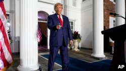 Former US President Donald Trump arrives to speak at Trump National Golf Club in Bedminster, NJ, June 13, 2023, after pleading not guilty to dozens of felony counts that he hoarded classified documents and refused government demands to give them back.