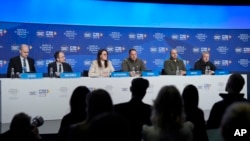 Participants of talks on developing a peace formula for Russia's war on Ukraine speak at news conference after meeting in Davos, Switzerland, Jan. 14, 2024.