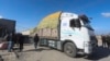 Humanitarian aid trucks enter the Gaza Strip from Israel through the Kerem Shalom crossing, in Rafah, Jan. 14, 2024. 