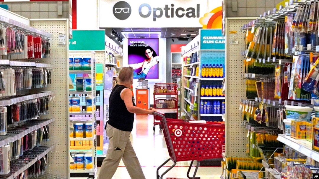 FILE - A shopper looks down an aisle in a Target store in Upper Saint Clair, Pennsylvania, July 7, 2023. U.S. consumer prices rose 3% in June compared with a year ago, the government reported July 12, 2023.