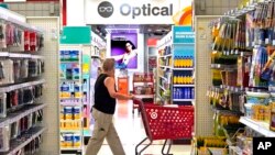 FILE - A shopper looks down an aisle in a Target store in Upper Saint Clair, Pennsylvania, July 7, 2023. U.S. consumer prices rose 3% in June compared with a year ago, the government reported July 12, 2023.