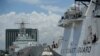 The U.S. Coast Guard Cutter Stratton, right, and Japanese Coast Guard Akitsushima dock as they arrive at the pier in Manila, Philippines on June 1, 2023. (Aaron Favila/AP)