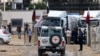 Vehicles of the International Red Cross carrying aid prepare to cross into Rafah in the southern Gaza Strip on Nov. 15, 2023, amid the ongoing battles between Israel and the Palestinian group Hamas.