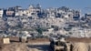 FILE - Israeli troops operate on their side of the fence separating Israel from the Gaza Strip, Aug. 29, 2024, amid the ongoing conflict between Israel and the militant group Hamas. 