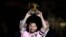 FILE - Inter Miami forward Lionel Messi holds his Ballon d'Or trophy before the team's club friendly soccer match against New York City FC, Nov. 10, 2023, in Fort Lauderdale, Florida. Messi won FIFA’s best men’s player award Jan. 15, 2024. 