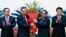 Vietnamese Prime Minister Pham Minh Chinh, right, congratulates Vietnamese President To Lam with flowers as he was confirmed the new Community Party Chief, the country's most powerful role, on Aug. 3, 2024, Hanoi, Vietnam. 