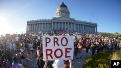 FILE - People attend an abortion-rights rally at the Utah State Capitol in Salt Lake City after the US Supreme Court overturned Roe v. Wade, June 24, 2022.