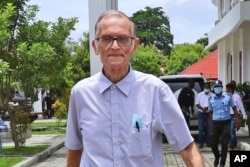 FILE - Richard Daschbach, a former missionary from Pennsylvania, arrives for trial in Oecusse, East Timor, Feb. 23, 2021. The defrocked American priest accused of sexually abusing girls was found guilty Dec. 21, 2021, and sentenced to 12 years in prison.