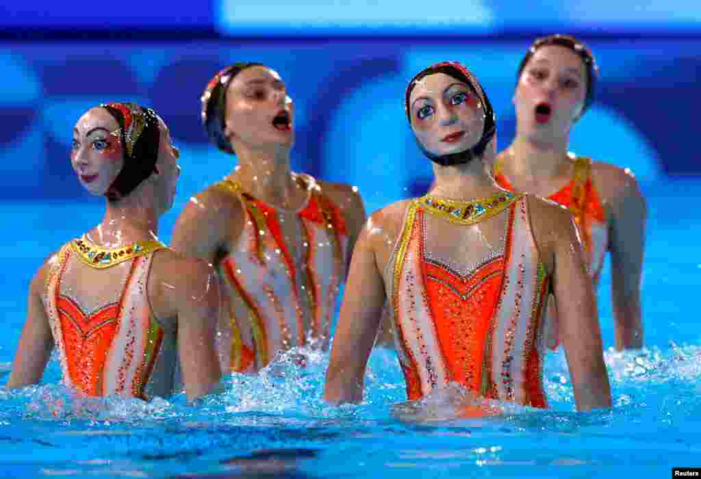 Laelys Alavez, Anastasia Bayandina, Ambre Esnault, Laura Gonzalez, Romane Lunel, Eve Planeix, Charlotte Tremble, Laura Tremble of France perform during the artistic swimming free routine in the Aquatics Center in Saint-Denis, France, Aug. 6, 2024.