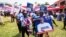 Supporters hold a placard depicting Mahamudu Bawumia, vice president of Ghana and presidential candidate of the New Patriotic Party NPP for the 2024 presidential elections, in Takoradi, Ghana, Aug. 18, 2024.