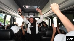 SAG-AFTRA President Fran Drescher, center, boards a bus with guild members traveling to picket lines in Los Angeles, California. Tens of thousands of Hollywood actors went on strike, effectively bringing the giant movie and television business to a halt as they joined writers in the first industry-wide walkout in 63 years. 