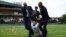A Just Stop Oil protester is detained by security staff on Court 18 during the first round match between Britain's Katie Boulter and Australia's Daria Saville on July 5, 2023. 
