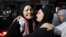Rawda Abu Ajamieh, left, hugs a relative after her release from an Israeli prison as part of a truce agreement between Israel and Hamas, in the al-Duheishe refugee camp in Bethlehem's occupied West Bank, Nov. 24, 2023.