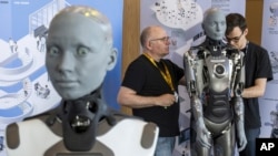 FILE- Humanoid robot Ameca during the ITU's 'AI for Good' Global Summit in Geneva, Switzerland, July 5 2023. Robotics innovators, their creations joined diplomats in Geneva, July 6-7.