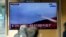 A TV screen shows file footage of a North Korean cruise missile during a news program at the Seoul Railway Station, in Seoul, South Korea, Jan. 24, 2024.