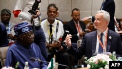 Rais wa Nigeria Bola Ahmed Tinubu (kushoto) wakati wa Mkutano wa Viongozi wa G20 huko New Delhi Septemba 9, 2023. Picha na Ludovic MARIN / POOL / AFP. 