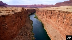 FILE - The Colorado River in the upper River Basin is pictured in Lees Ferry, Arizona, May 29, 2021.