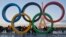 FILE - The Olympic rings are set up in Paris, France, Thursday, Sept. 14, 2017 at Trocadero plaza that overlooks the Eiffel Tower, a day after the official announcement that the 2024 Summer Olympic Games will be in the French capital. 