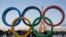 FILE - The Olympic rings are set up in Paris, France, Thursday, Sept. 14, 2017 at Trocadero plaza that overlooks the Eiffel Tower, a day after the official announcement that the 2024 Summer Olympic Games will be in the French capital. 