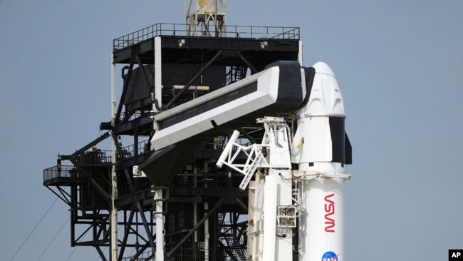 A crew Dragon capsule is shown on top of a SpaceX Falcon 9 rocket as she sits on Launch Pad 39-A, March 2, 2024, at the Kennedy Space Center in Cape Canaveral, Fla.