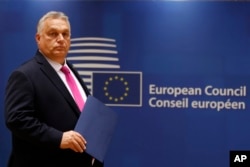 FILE - Hungary's Prime Minister Viktor Orban arrives for a meeting at an EU summit in Brussels on Oct. 26, 2023.