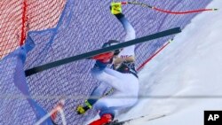 FILE - Norway's Aleksander Aamodt Kilde falls during an alpine ski, men's World Cup downhill race, in Wengen, Switzerland, Jan. 13, 2024.