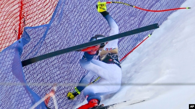 FILE - Norway's Aleksander Aamodt Kilde falls during an alpine ski, men's World Cup downhill race, in Wengen, Switzerland, Jan. 13, 2024.