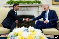 President Joe Biden shakes hands with British Prime Minister Rishi Sunak as they meet in the Oval Office of the White House in Washington, Thursday, June 8, 2023.