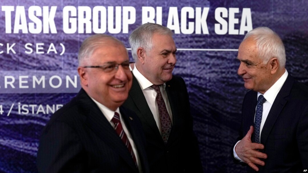 Turkey's Defense Minister Yasar Guler, left, Romania's Defense Minister Angel Tilvar, center, and Bulgaria's Deputy Defense Minister Atanas Zapryanov talk in Istanbul, Turkey, Jan. 11, 2024.