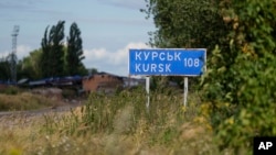 A sign for Kursk is seen on the Russian-Ukrainian border in Sumy region, Ukraine, Aug. 13, 2024.