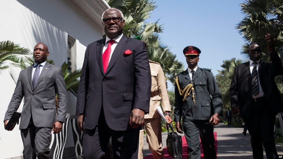 FILE - Ernest Bai Koroma, center, then-president of Sierra Leone, is seen during a visit to Banjul, Gambia, Dec. 13, 2016. Koroma has been charged with treason for his alleged involvement in a failed coup in November, Sierra Leone's government said Jan. 3, 2024.