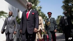 FILE - Ernest Bai Koroma, center, then-president of Sierra Leone, is seen during a visit to Banjul, Gambia, Dec. 13, 2016. Koroma has been charged with treason for his alleged involvement in a failed coup in November, Sierra Leone's government said Jan. 3, 2024.