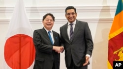 Japanese Foreign Minister Yoshimasa Hayashi, left, meets with his Sri Lankan counterpart, Ali Sabry, in Colombo, Sri Lanka, July 29, 2023.