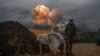 An Israeli mobile artillery unit fires a shell from northern Israel towards Lebanon, Jan. 11, 2024.