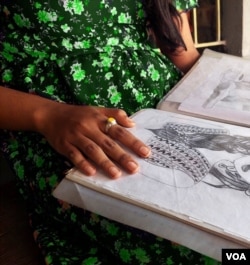 Prodeepa, a child marriage survivor, flips through some of the illustrations she made while at a government-approved rehabilitation center. (Sarah Aziz/VOA)