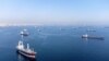 FILE: Commercial vessels, including some that are part of the Black Sea grain deal, wait to pass the Bosphorus strait off the shores of Yenikapi, in Istanbul, Turkey, Oct. 31, 2022.