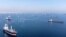 FILE: Commercial vessels, including some that are part of the Black Sea grain deal, wait to pass the Bosphorus strait off the shores of Yenikapi during a misty morning in Istanbul, Turkey, October 31, 2022