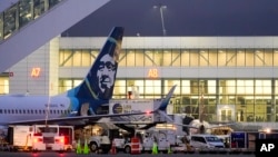 FILE - An Alaska Airlines aircraft is seen at Seattle-Tacoma International Airport, Jan. 10, 2024, in Seattle. An apparent cyberattack disrupted operations at the airport for the third day on Aug. 26, 2024. 