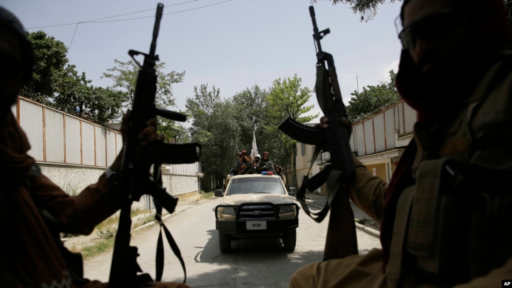 FILE - Taliban fighters patrol in Kabul, Afghanistan, on Aug. 19, 2021. 